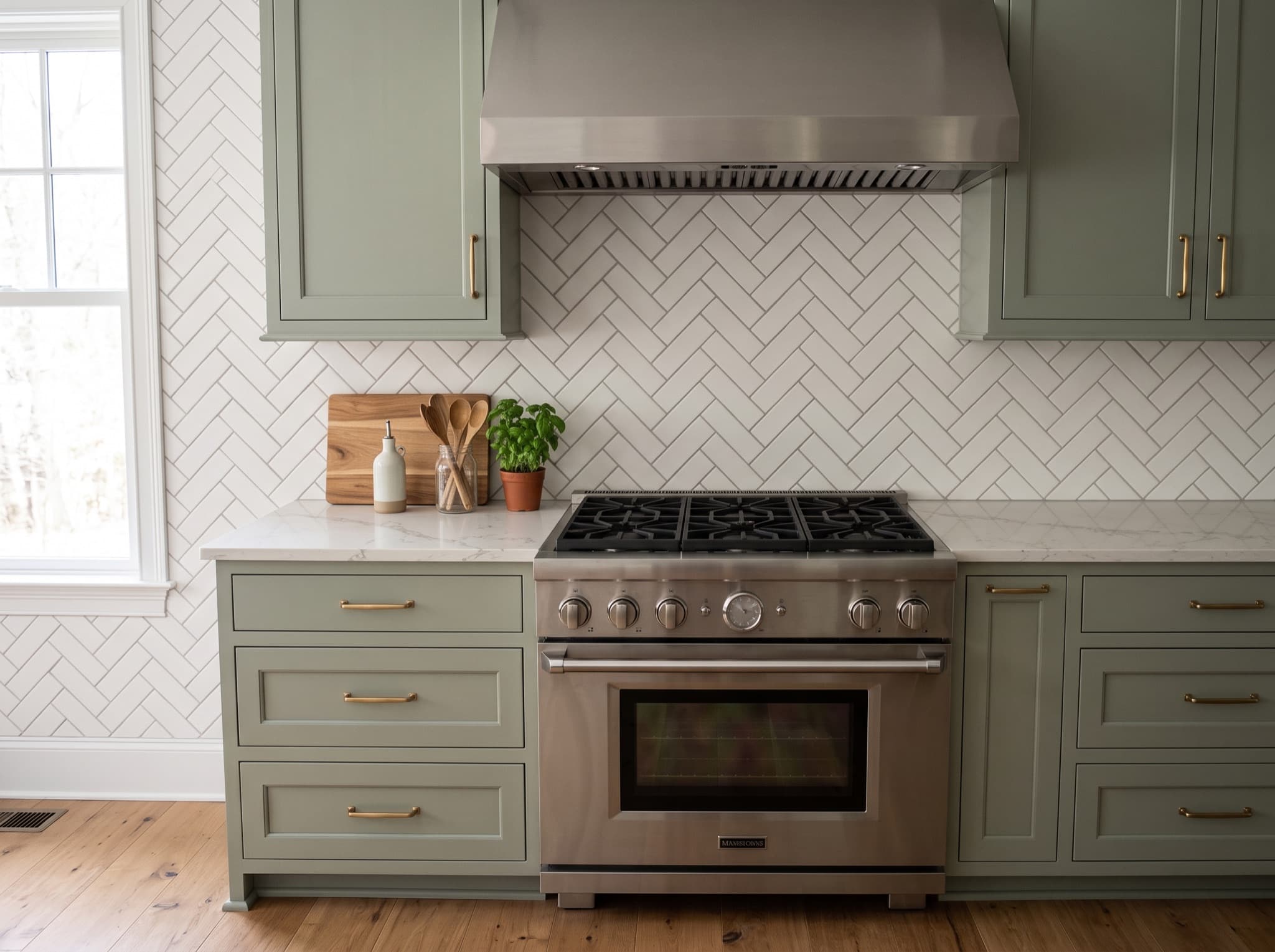 AI kitchen backsplash ideas with herringbone tile behind the range