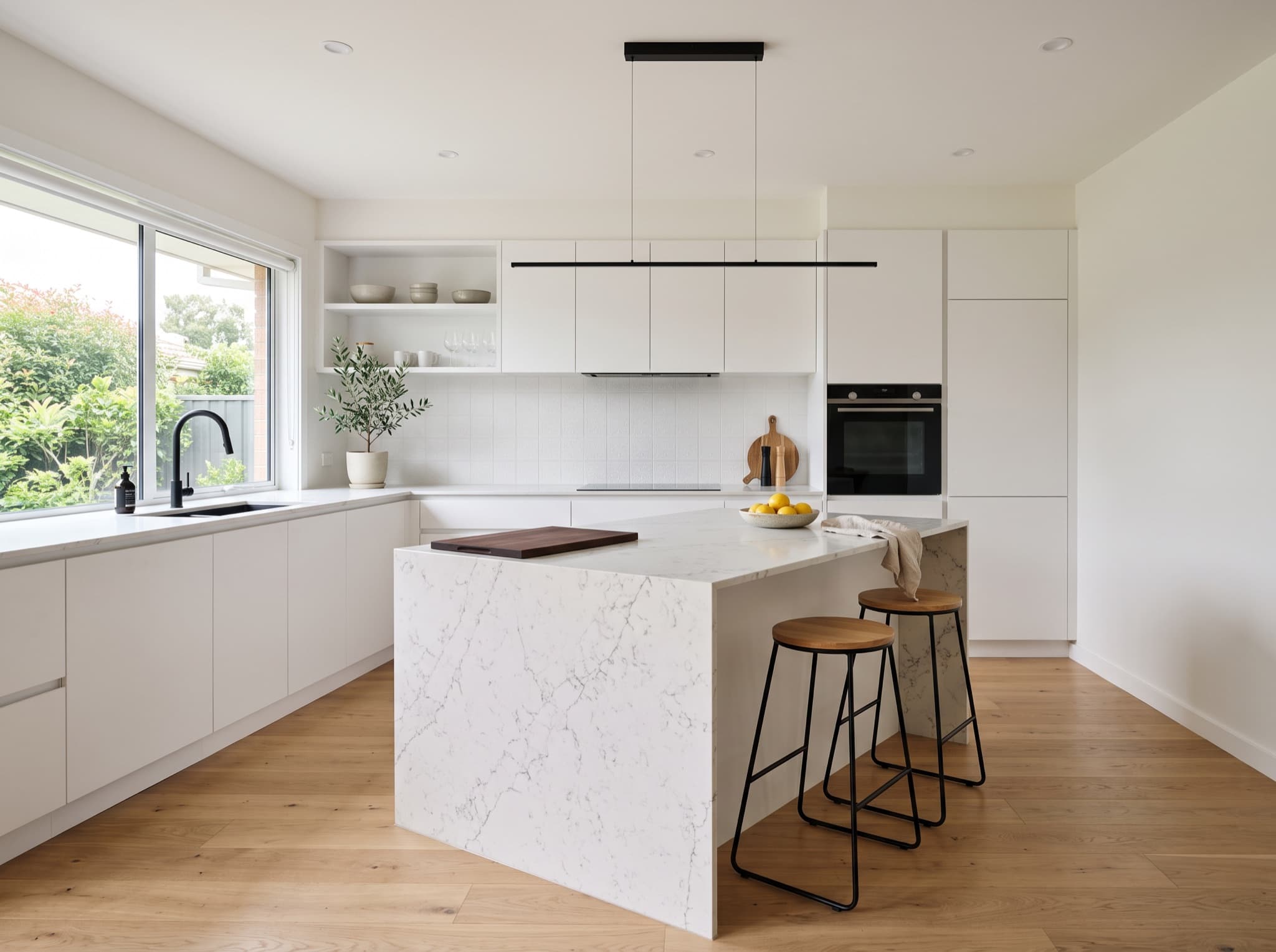 Modern AI kitchen design with handleless cabinets and a quartz waterfall island